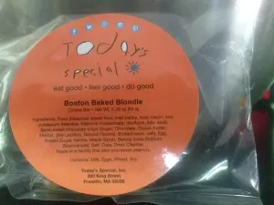 Close-up of a wrapped Boston Baked Blondie with its orange Today's Special label and ingredient list
