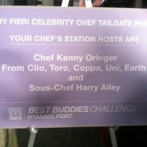Event sign for the Celebrity Chef Tailgate listing the station hosts, including Sous-Chef Harry Alley