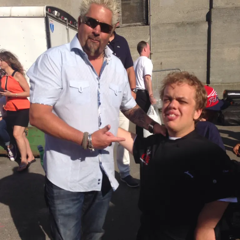 Harry with celebrity chef Guy Fieri at a community event