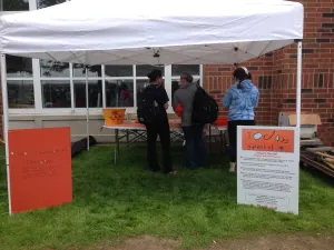 The Today's Special booth under a white canopy, with an orange sign and an information board